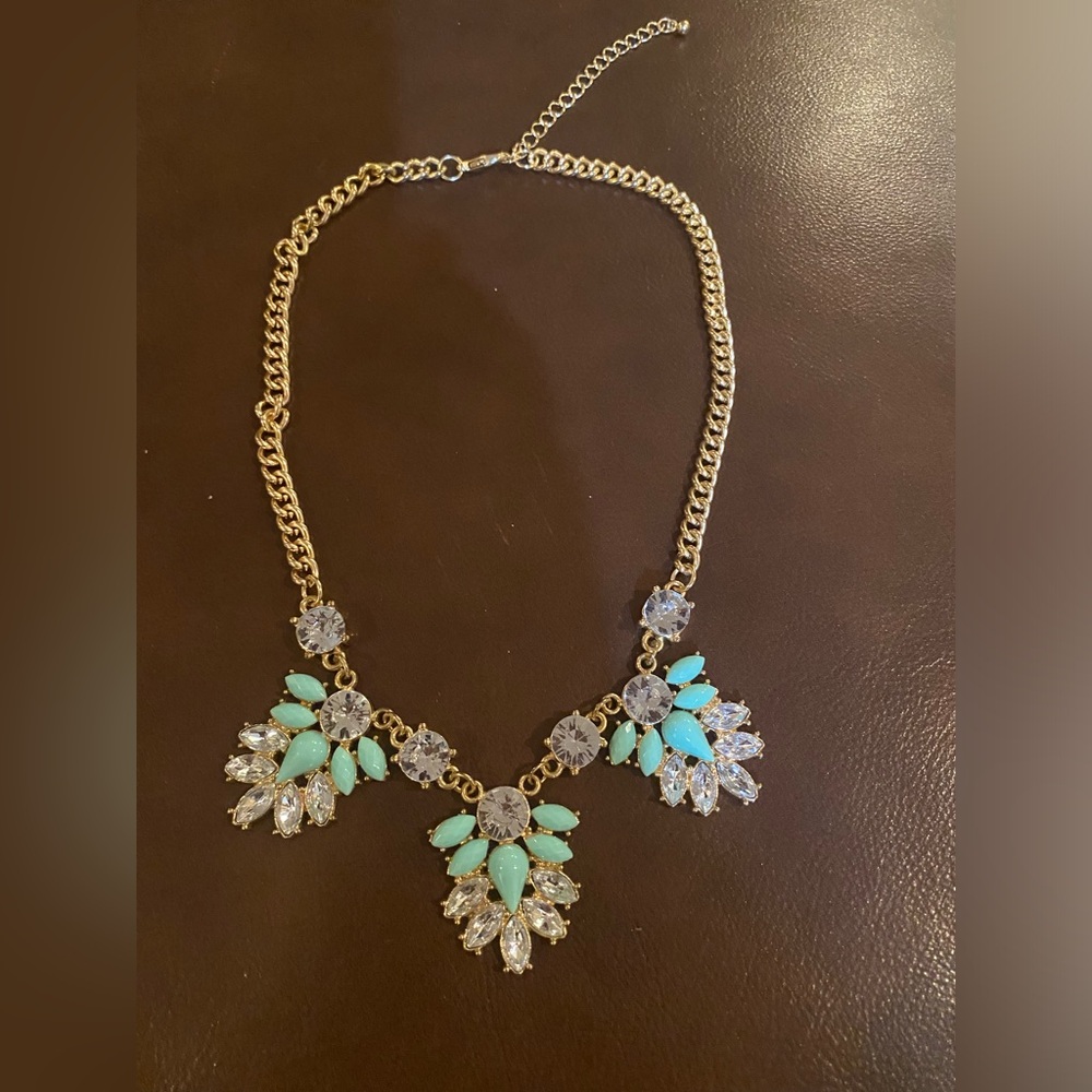 Beautiful gold statement necklace with crystal gemstone & Pearl Green gems.